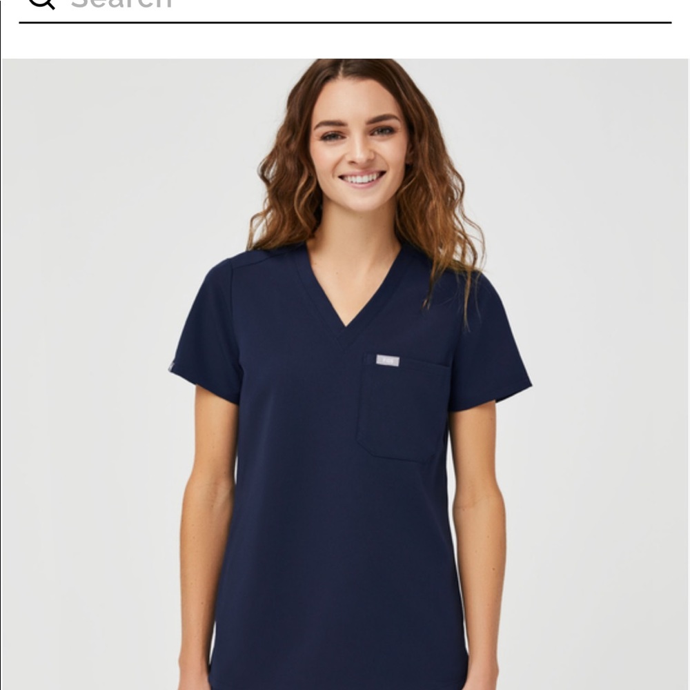 Figs navy blue medium one pocket top. Like new. No flaws. Worn a couple times.